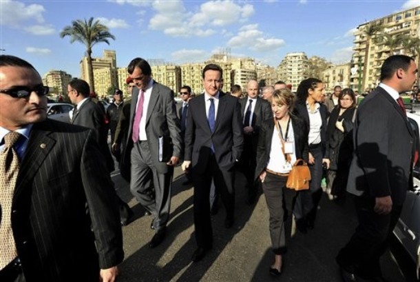 David Cameron –- Escorting Arms Dealers to Huge Mid-East Defense Expo –- Drops By Tahrir Square