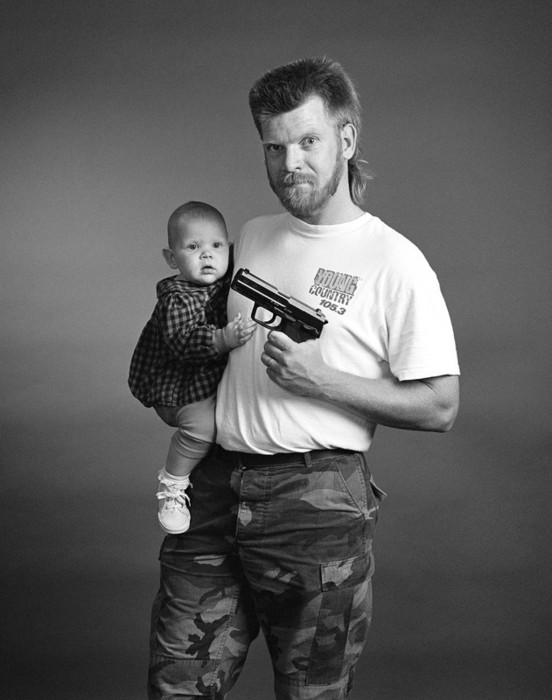 Zed Nelson man w baby and gun
