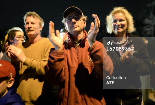 Residents clap for suspect capture Watertown