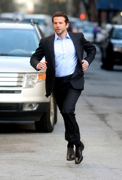 Bradley Cooper runs in a suit