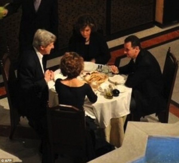 Kerry Assad with wives AFP 09