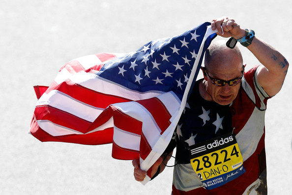 Bald man flag marathon Getty