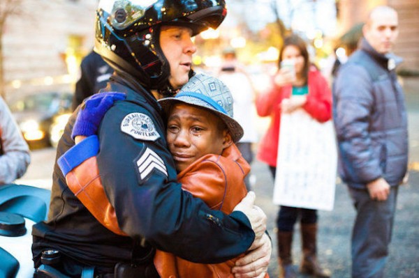 Quick Takes: On the "Black Kid/White Cop" Ferguson Protest Hug