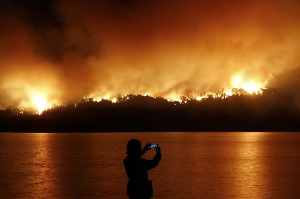 Why all the Photos of People Taking Photos, Especially When Heavy Things Are Going Down?