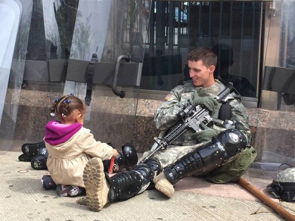 On the Viral Photo of the Baltimore Girl and the National Guardsman (and the Portland "Ferguson Hug")