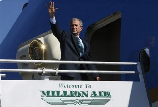 President Bush waves as he departs Alexandria International Airport in Alexandria, La., Monday, Oct. 20, 2008. (AP Photo/Charles Dharapak)