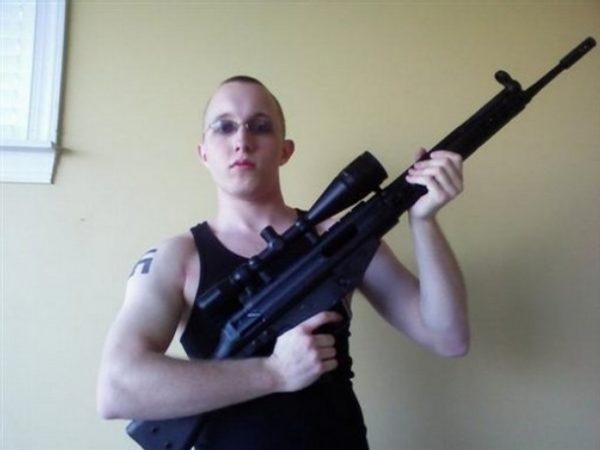 This undated photo obtained from a MySpace webpage shows Daniel Cowart, 20 of Bells, Tenn. holding a weapon. Federal agents have broken up a plot to assassinate Democratic presidential candidate Sen. Barack Obama, D-Ill. and shoot or decapitate 102 black people in a Tennessee murder spree, the ATF said Monday Oct. 27, 2008. In court records unsealed Monday, federal agents said they disrupted plans to rob a gun store and target a predominantly African-American high school by two neo-Nazi skinheads. The men, Daniel Cowart, 20, of Bells, Tenn., and Paul Schlesselman 18, of West Helena, Ark., are being held without bond. (AP Photo) ** NO SALES ** ** AP provides access to this photo to be used only to illustrate news reporting or commentary on the facts or events surrounding the plot to assassinate Democratic presidential candidate Sen. Barack Obama and murder 102 black people in Tennessee.**