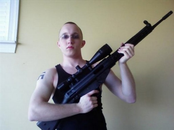 This undated photo obtained from a MySpace webpage shows Daniel Cowart, 20 of Bells, Tenn. holding a weapon. Federal agents have broken up a plot to assassinate Democratic presidential candidate Sen. Barack Obama, D-Ill. and shoot or decapitate 102 black people in a Tennessee murder spree, the ATF said Monday Oct. 27, 2008. In court records unsealed Monday, federal agents said they disrupted plans to rob a gun store and target a predominantly African-American high school by two neo-Nazi skinheads. The men, Daniel Cowart, 20, of Bells, Tenn., and Paul Schlesselman 18, of West Helena, Ark., are being held without bond.  (AP Photo)  ** NO SALES ** ** AP provides access to this photo to be used only to illustrate news reporting or commentary on the facts or events surrounding the plot to assassinate Democratic presidential candidate Sen. Barack Obama and murder 102 black people in Tennessee.**