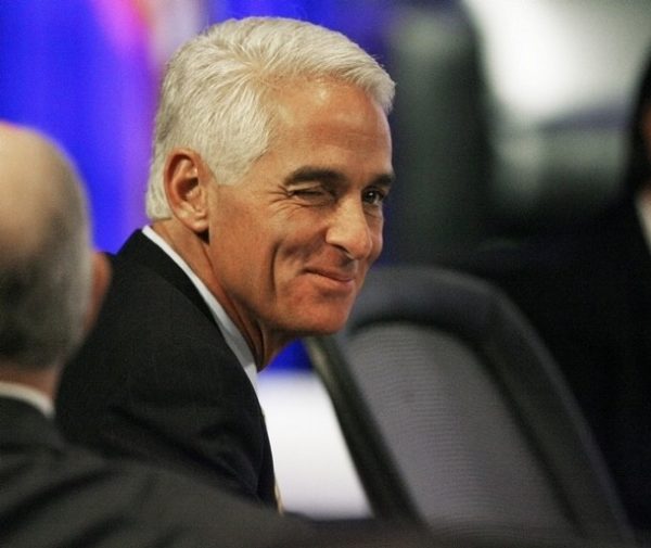 Governor Charile Crist (R-FL) winks at an unidentified spectator during an address by Gov. Sarah Palin during a Plenary Session at the 2008 Republican Governors Association Annual Conference in Miami November 13, 2008. REUTERS/Hans Deryk (UNITED STATES)