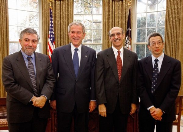 WASHINGTON - NOVEMBER 24: U.S. President George W. Bush (2L) poses for photographs with the American winners of the 2008 Nobel Prize for Chemistry Roger Yonchien Tsien (R) and Martin Chalfie (2R) and the winner for Economics Paul Krugman in the Oval Office at the White House November 24, 2008 in Washington, DC. Tsien of the University of California, San Diego, and Chalfie of Columbia University shared the prize for their discovery and development of the green fluorescent protein. Krugman, a New York Times columnist and professor at Princeton University who has been very critical of President Bush's economic and international policies, won for his analysis of trade patterns and location of economic activity. (Photo by Chip Somodevilla/Getty Images)