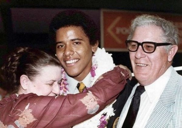 ** FILE ** This 1979 file photo provided by the presidential campaign of Sen. Barack Obama, D-Ill., shows the presidential hopeful, Obama, in 1979 during his high school graduation in Hawaii with his maternal grandparents, Stanley Armour Dunham and his wife Madelyn Payne, both natives of Kansas. Growing up as a young man of mixed race, Obama benefited from the spirit of tolerance that defined Hawaii's racial climate. His childhood in the country's idealized melting pot was far from painless, though. (AP Photo/Obama Presidential Campaign/file)