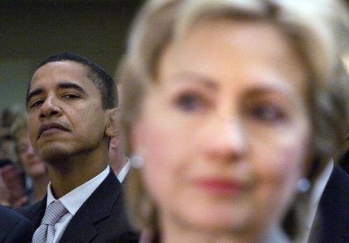 Washington, UNITED STATES: US Senator Barack Obama (L) (D-IL), and Senator Hillary Rodham Clinton (D-NY) listen to President George W. Bush speak during the National Prayer Breakfast 01 February 2007 in Washington, DC. AFP PHOTO/Brendan SMIALOWSKI (Photo credit should read BRENDAN SMIALOWSKI/AFP/Getty Images)