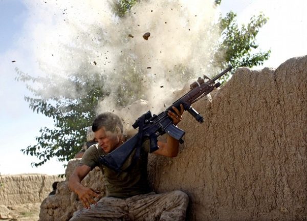 RNPS IMAGES OF THE YEAR 2008 Sgt. William Olas Bee, a U.S. Marine from the 24th Marine Expeditionary Unit, has a close call after Taliban fighters opened fire near Garmser in Helmand Province of Afghanistan May 18, 2008. The Marine was not injured. REUTERS/Goran Tomasevic (AFGHANISTAN)