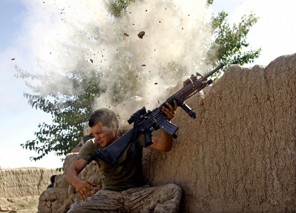 RNPS IMAGES OF THE YEAR 2008  Sgt. William Olas Bee, a U.S. Marine from the 24th Marine Expeditionary Unit,  has a close call after Taliban fighters opened fire near Garmser in Helmand Province of Afghanistan May 18, 2008.  The Marine was not injured. REUTERS/Goran Tomasevic  (AFGHANISTAN)