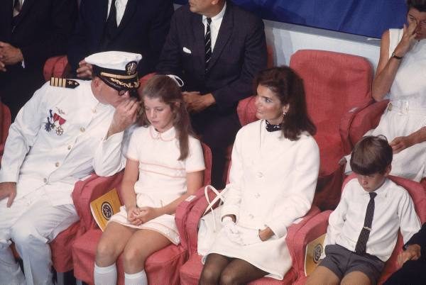 Charles H. Phillips. May 27, 1967. September 7, 1968. caption: Jacqueline Kennedy (2R) sitting with daughter Caroline (2L) & son John Jr. (R) at ceremonies for commissioning of the Navy aircraft carrier USS John F. Kennedy, with dignitaries & other members of the Kennedy family.