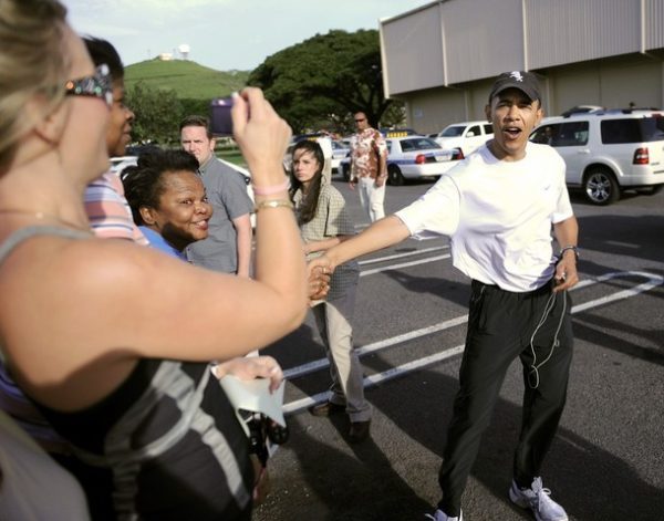 US President-elect Barack Obama greets people after working out at the Semper Fit gym on Marine Corps Base Hawaii while on vacation over the holidays in Kailua, Hawaii on December 26, 2008. The Obama family celebrated Christmas by opening presents at their vacation rental compound in Kailua.AFP PHOTO / TIM SLOAN (Photo credit should read TIM SLOAN/AFP/Getty Images)