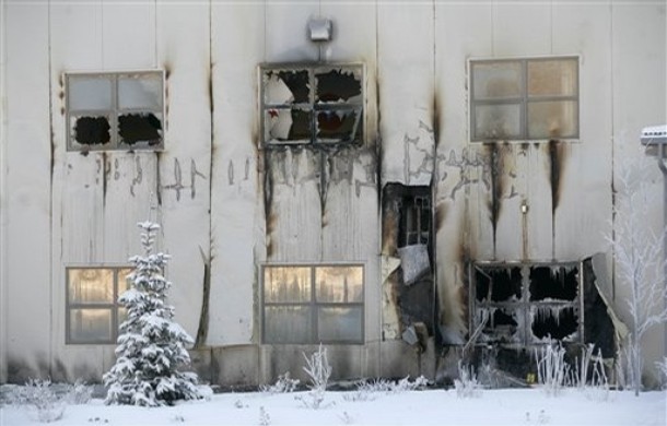 A snow covered tree sits outside of the fire damaged Wasilla Bible Church in Wasilla, Alaska Saturday Dec. 13, 2008. Alaska Gov. Sarah Palin's home church was badly damaged in an arson fire. No one was injured in the fire, which was intentionally set while people, including two children, were inside. (AP Photo/Al Grillo)