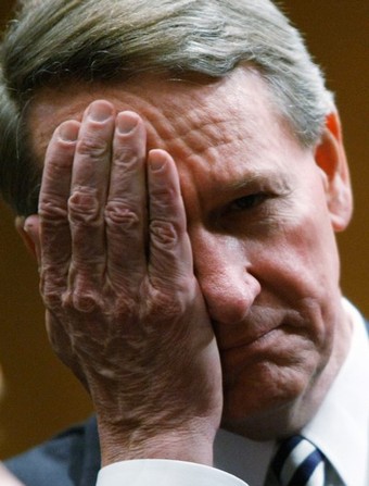 WASHINGTON - DECEMBER 04: Richard Wagoner Jr., chairman and CEO of General Motors (L), wipes his eyes as he awaits the start of a Senate hearing on the auto industry December 4, 2008 in Washington, DC. Leaders from the three major U.S. automakers are scheduled to appear before members of the Senate today to discuss proposed bailout legislationm for their industry. (Photo by Chip Somodevilla/Getty Images)