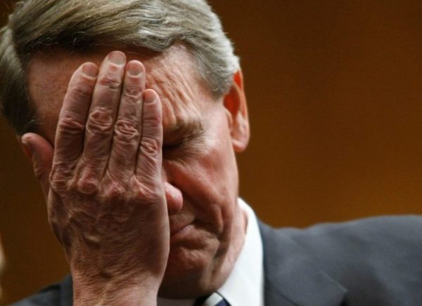 WASHINGTON - DECEMBER 04: Richard Wagoner Jr., chairman and CEO of General Motors (L) wipes his eyes as he awaits the start of a Senate hearing on the auto industry December 4, 2008 in Washington, DC. Leaders from the three major U.S. automakers are scheduled to appear before members of the Senate today to discuss proposed bailout legislationm for their industry. (Photo by Chip Somodevilla/Getty Images)