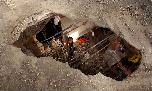 image: Ibraheem Abu Mustafa/Reuters. caption: INCOMING Palestinians in their damaged Gaza homes after an air raid in Rafah.