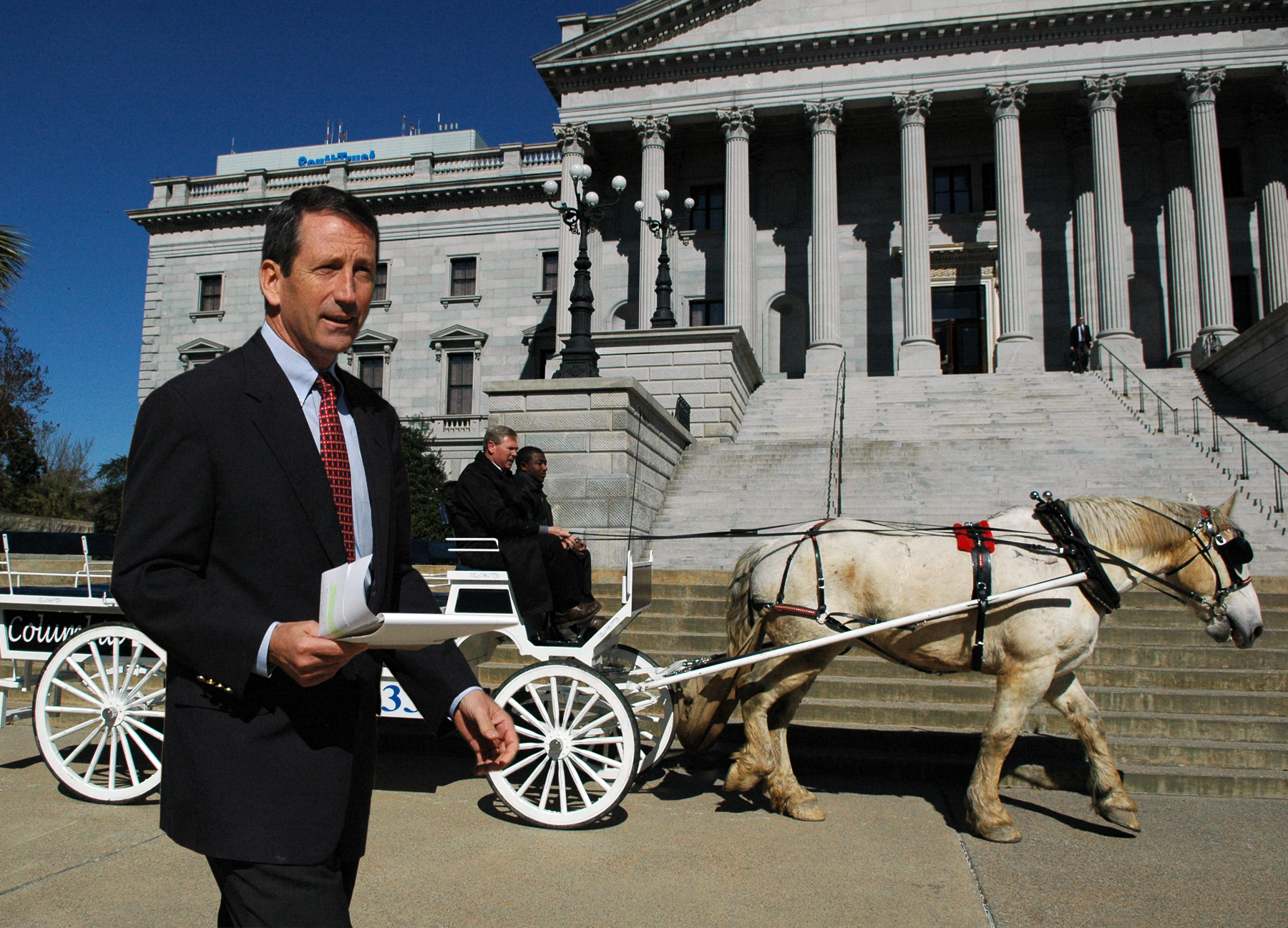 3/2/2005 - South Carolina Governor's Office. caption: Governor Sanford brings horse and buggy to SC Statehouse