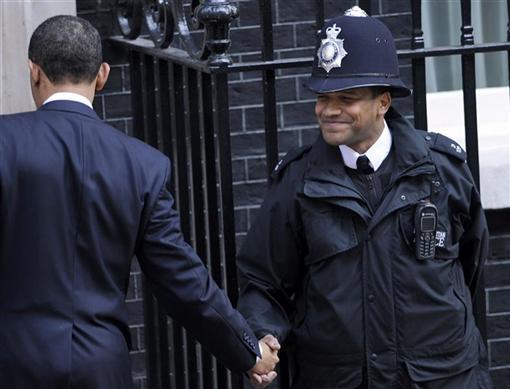 President Obama shakes hands with a British police officer outside 10 Downing Street in London, April 1, 2009. REUTERS/Toby Melville
