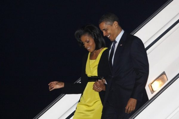 U.S. President Barack Obama and first lady Michelle Obama arrive at London's Stansted Airport, March 31, 2009. Obama arrived in Britain on Tuesday for this week's G20 economic crisis summit, starting his first major trip abroad since taking office on Jan. 20.   REUTERS/Jason Reed     (BRITAIN POLITICS)