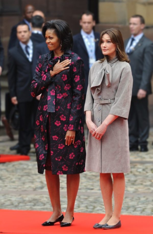 US First Lady Michelle Obama (L) and French First Lady Carla Bruni-Sarkozy are pictured at the start of the NATO summit on April 3, 2009 in Strasbourg. The summit, which marks the organisation's 60th anniversary, is taking place on April 3 and 4, 2009 in Strasbourg and the neighbouring German cities of Baden-Baden and Kehl.AFP PHOTO / Saul Loeb   (Photo credit should read SAUL LOEB/AFP/Getty Images)