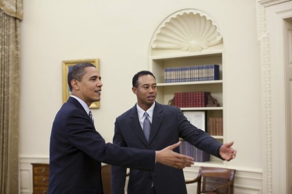U.S. President Barack Obama greets professional golfer Tiger Woods (R) in the Oval Office April 20, 2009. The 14-time major winner visited the White House following a press conference for the AT&T National, the PGA Tour event Woods hosts at Congressional Country Club June 29-July 5. Picture taken April 20, 2009.   REUTERS/Pete Souza-The White House/Handout (POLITICS SPORT GOLF)