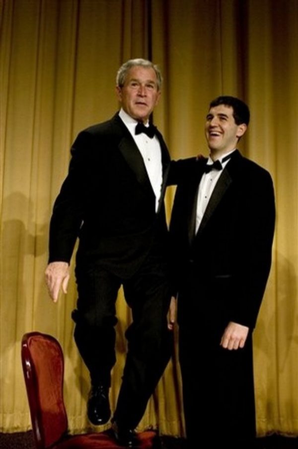 President Bush, left, stands on a chair next to David J. Rivelli, one of two recipients of the Deborah Orin Scholarship, during the annual dinner of the White House Correspondents' Association, Saturday, April 26, 2008, in Washington. When Rivelli was taking his picture with Bush, Bush quickly noticed how much taller Rivelli was and decided to gain a foot or two by standing on the chair. (AP Photo/Haraz N. Ghanbari)