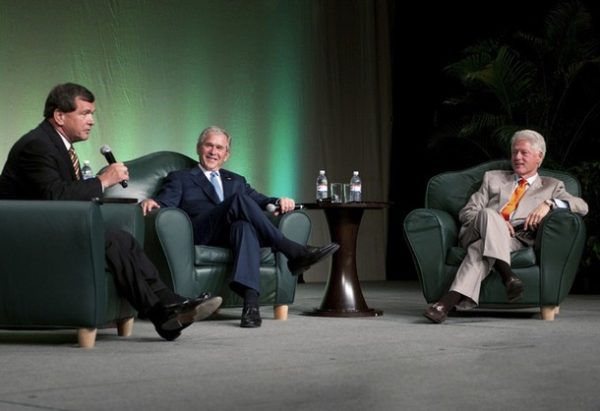 Former Canadian Ambassador to the U.S. Frank McKenna (L) moderates a discussion on global affairs between former U.S. Presidents George W. Bush (C) and Bill Clinton (R) at a convention center in this handout photo released by TD Bank from the event in Toronto, May 29, 2009. This is the first time the two presidents have participated in a joint event together.   REUTERS/TD Bank Financial Group/Handout  (CANADA POLITICS) FOR EDITORIAL USE ONLY. NOT FOR SALE FOR MARKETING OR ADVERTISING CAMPAIGNS