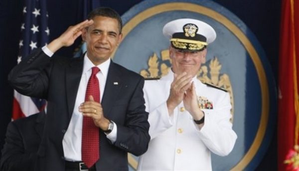 President Barack Obama salutes Sen. John McCain, R-Ariz., as he is acknowledged at the United States Naval Academy graduation ceremony in Annapolis, Md., Friday, May 22, 2009. At right is Naval Academy Superintendent Vice Adm. Jeffrey L. Fowler. (AP Photo/Charles Dharapak)