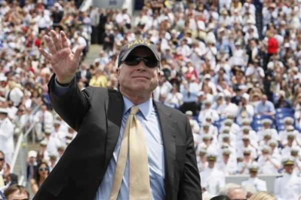 Sen. John McCain, R-Ariz. waves as he is acknowledged at the United States Naval Academy graduation ceremony, attended by President Barack Obama, not pictured, Friday, May 22, 2009, in Annapolis, Md. (AP Photo/Charles Dharapak)