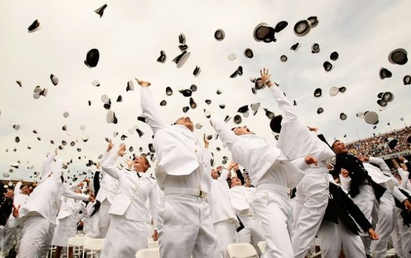 ANNAPOLIS, MD - MAY 22:  Navy and Marine commission officers toss their hats up to the sky as they celebrate after they took the oath to become commission officers during the annual Naval Academy Graduation and Commissioning Ceremony at the Navy-Marine Corps Memorial Stadium May 22, 2009 in Annapolis, Maryland. President Barack Obama delivered the commencement address to the 1036 graduates of the class of 2009.  (Photo by Alex Wong/Getty Images)
