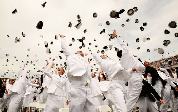 ANNAPOLIS, MD - MAY 22: Navy and Marine commission officers toss their hats up to the sky as they celebrate after they took the oath to become commission officers during the annual Naval Academy Graduation and Commissioning Ceremony at the Navy-Marine Corps Memorial Stadium May 22, 2009 in Annapolis, Maryland. President Barack Obama delivered the commencement address to the 1036 graduates of the class of 2009. (Photo by Alex Wong/Getty Images)