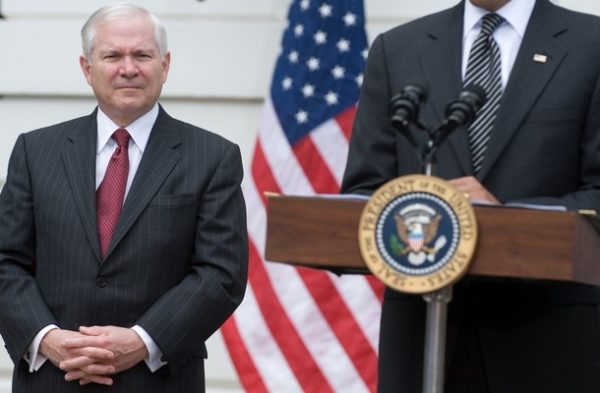 US Secretary of Defense Robert Gates listens as US President Barack Obama speaks during a ceremony to start the White House to Light House Wounded Warrior Soldier Ride on the South Lawn of the White House in Washington, DC, April 30, 2009. The program helps rehabilitate wounded veterans and Obama kicked off the start of a ride that will take the bikers from the White House to Arlington Cemetery, before continuing Friday to Annapolis, Maryland. AFP PHOTO / Saul LOEB (Photo credit should read SAUL LOEB/AFP/Getty Images)