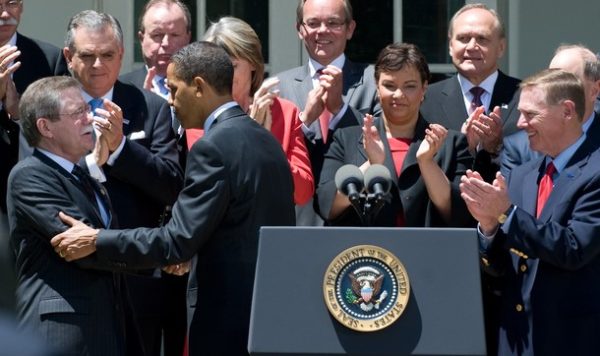 US President Barack Obama shakes hands with United Auto Workers(UAW) President Ron Gettelfinger (L) as he stands alongside leaders of worldwide automakers and members of his Cabinet after announcing new fuel efficiency standards to curb auto emissions for US cars in the Rose Garden of the White House in Washington, DC, May 19, 2009. AFP PHOTO / Saul LOEB (Photo credit should read SAUL LOEB/AFP/Getty Images)