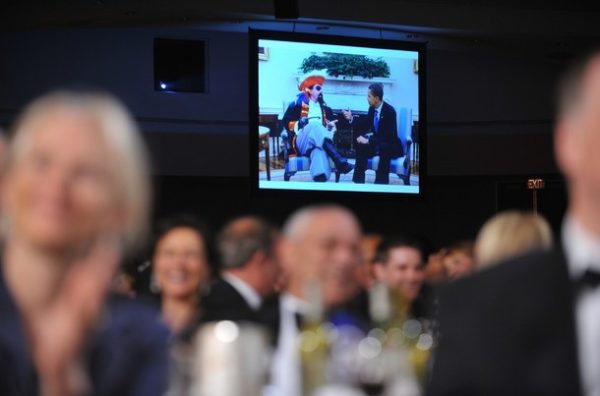 An image of US President Barack Obama in the Oval Office with a pirate is seen on a large screen while Obama tells a joke during the White House Correspondents��� Association annual dinner on May 9, 2009 at the Washington Hilton hotel in Washington. AFP PHOTO/Mandel NGAN (Photo credit should read MANDEL NGAN/AFP/Getty Images)