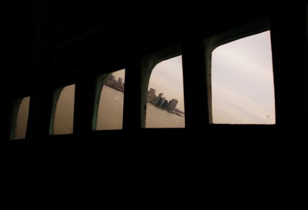 NEW YORK - MAY 08: Lower Manhattan is seen through the windows in the crown of the Statue of Liberty on May 8, 2009 in New York City. Secretary of the Interior Ken Salazar announced that the crown of the famous statue, which was closed to the public after the September 11 terrorist attacks, will be open again on July 4 of this year to a limited number of visitors a day. (Photo by Chris Hondros/Getty Images)