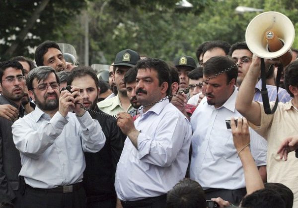 EDITORS' NOTE: Reuters and other foreign media are subject to Iranian restrictions on their ability to report, film or take pictures in Tehran.   Iranians connect a mobile phone to an amplifier so protesters can hear defeated Iranian presidential candidate Mirhossein Mousavi  addressing them near Ghoba mosque in northern Tehran June 28, 2009.  QUALITY FROM SOURCE   REUTERS/via Your View   (IRAN CONFLICT POLITICS)