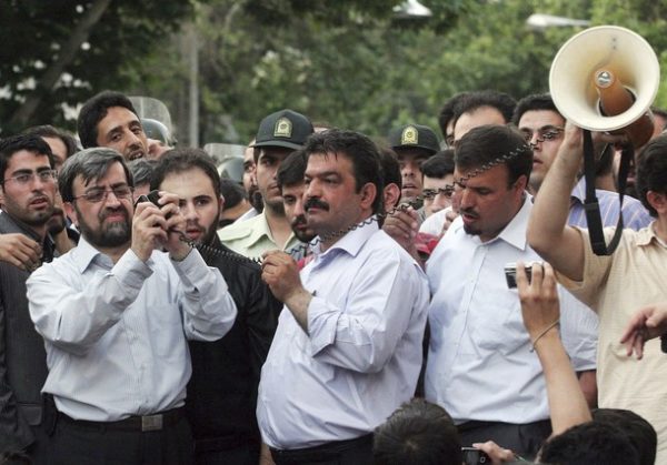 EDITORS' NOTE: Reuters and other foreign media are subject to Iranian restrictions on their ability to report, film or take pictures in Tehran. Iranians connect a mobile phone to an amplifier so protesters can hear defeated Iranian presidential candidate Mirhossein Mousavi addressing them near Ghoba mosque in northern Tehran June 28, 2009. QUALITY FROM SOURCE REUTERS/via Your View (IRAN CONFLICT POLITICS)