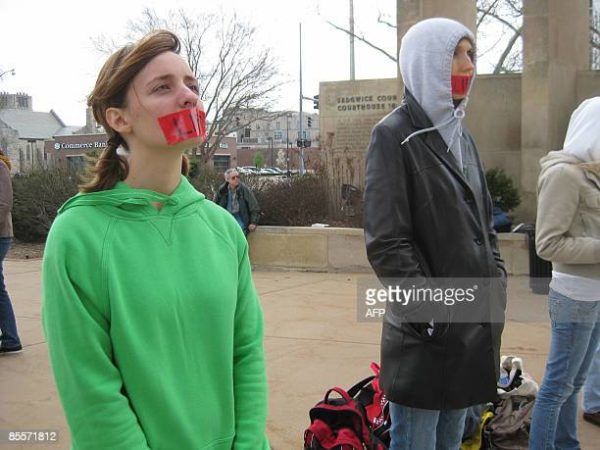 Abortion opponents hold a silent protest outside the courthouse on March 23, 2009 in Wichita, Kansas, where George Tiller faces criminal charges in a case which activists on both side of the decades-long battle over abortion rights say is intended to send a chill through the medical community. One of the few doctors who still performs late-term abortions in the United States, Tiller has been picketed, bombed and shot in the arms. He has been demonized by abortion opponents who regularly protest outside his clinic, located just off a busy highway that runs through Wichita. AFP PHOTO / Joe STUMPE (Photo credit should read JOE STUMPE/AFP via Getty Images)
