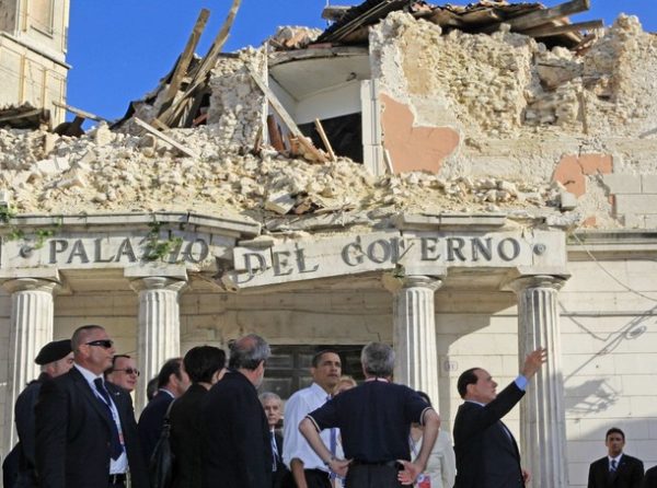 U.S. President Barack Obama tours the ruined city of Onna near L'Aquila in central Italy with Italian Prime Minister Silvio Berlusconi, July 8, 2009. Onna was almost totally destroyed in the April 6, 2009 earthquake in which some 300 people died. REUTERS/Jim Young (ITALY POLITICS DISASTER)