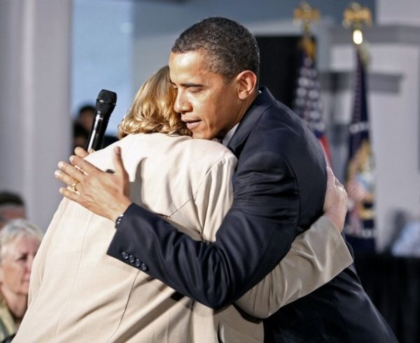 U.S. President Barack Obama hugs cancer patient Debby Smith of Appalachia, Virginia, during a forum on health care at Northern Virginia Community College in Annandale, Virginia July 1, 2009. REUTERS/Kevin Lamarque (UNITED STATES POLITICS HEALTH)