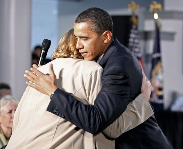 U.S. President Barack Obama hugs cancer patient Debby Smith of Appalachia, Virginia, during a forum on health care at Northern Virginia Community College in Annandale, Virginia July 1, 2009.  REUTERS/Kevin Lamarque   (UNITED STATES POLITICS HEALTH)