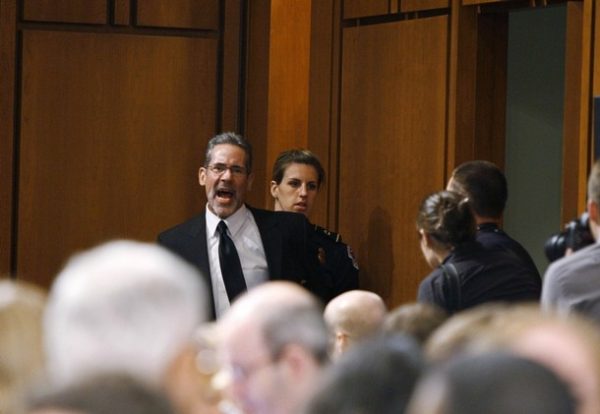 An anti-abortion protester is ejected by U.S. Capitol police after he began yelling during the start of the U.S. Senate Judiciary Committee confirmation hearings for U.S. Supreme Court nominee Judge Sonia Sotomayor, on Capitol Hill in Washington, July 13, 2009.     REUTERS/Jason Reed (UNITED STATES POLITICS CRIME LAW)
