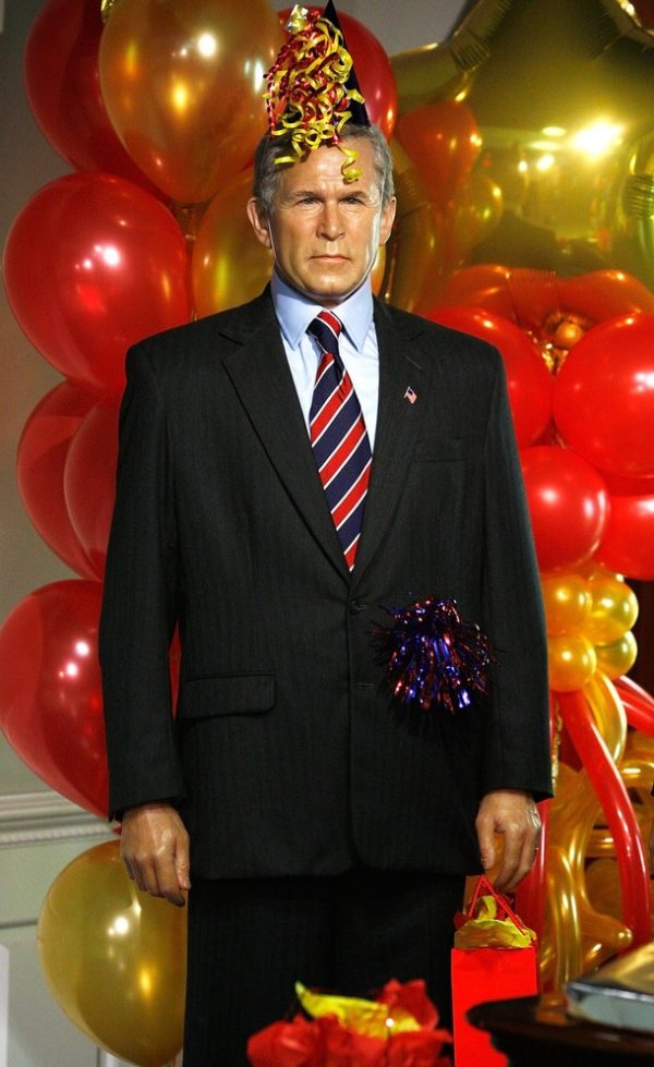 WASHINGTON - AUGUST 04: Birthday decorations are placed on the wax figure of former U.S. President George W. Bush in a mock Oval Office at Madame Tussauds Wax Museum August 4, 2009 in Washington, DC. The museum celebrated President Barack Obama's birthday with dressing the wax figures as party-goers and made them available for visitors to take pictures with. (Photo by Alex Wong/Getty Images)