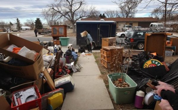 ADAMS COUNTY, CO - FEBRUARY 02: Mary Ann Smith collects some belongings after an eviction team removed the furniture from her foreclosed house on February 2, 2009 in Adams County, Colorado. Smith said she and her husband had been renting from an owner, who collected the monthly payments but had stopped paying his mortgage. The bank foreclosed on the property and called the Adams County sheriff's department to supervise the eviction. They managed to borrow enough money to rent another house for themselves and their four children, she said, but not in time to avoid eviction. (Photo by John Moore/Getty Images)