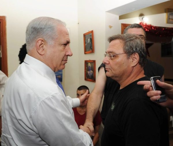 TEL, AVIV, ISRAEL - AUGUST 6: In this handout provided by the Israeli Government Press Office, Israeli PM Benjamin Netanyahu (L)  Visits "Beit paz" the gay youth center where two people were murdered, on August 6, 2008 in Tel Aviv, Israel. 26-year-old Nir Katz and 17-year-old Liz Trubeshi were killed  and ten others were injured in a shooting attack at the centre on Saturday August 1. Police are still hunting the gunman. (Photo by Moshe Milner/GPO via Getty Images)