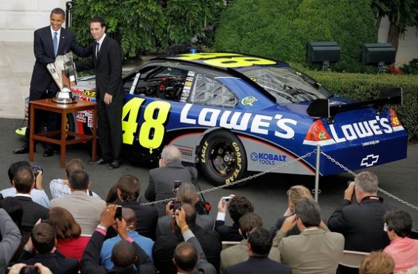WASHINGTON - AUGUST 19: U.S. President Barack Obama poses for photgraphs with NASCAR driver Jimmie Johnson during an event honoring Johnson, the 2008 Sprint Cup Champion, at the White House August 19, 2009 in Washington, DC. NASCAR drivers Carl Edwards, Greg Biffle, Clint Bowyer, Jeff Burton, Jeff Gordon, Denny Hamlin, Tony Stewart and Dale Earnhardt Jr. also attended the ceremony. (Photo by Chip Somodevilla/Getty Images)